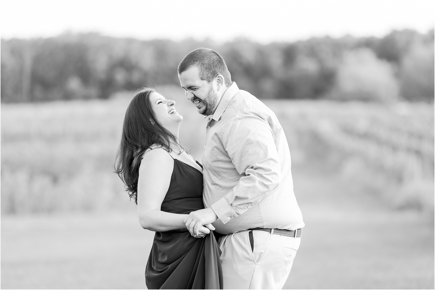 candid-romantic-summer-engagement-photos-at-hidden-lake-gardens-and-black-fire-winery-in-tipton-mi-by-courtney-carolyn-photography_0003.jpg