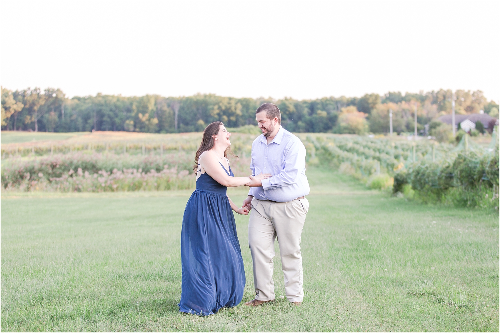 candid-romantic-summer-engagement-photos-at-hidden-lake-gardens-and-black-fire-winery-in-tipton-mi-by-courtney-carolyn-photography_0006.jpg