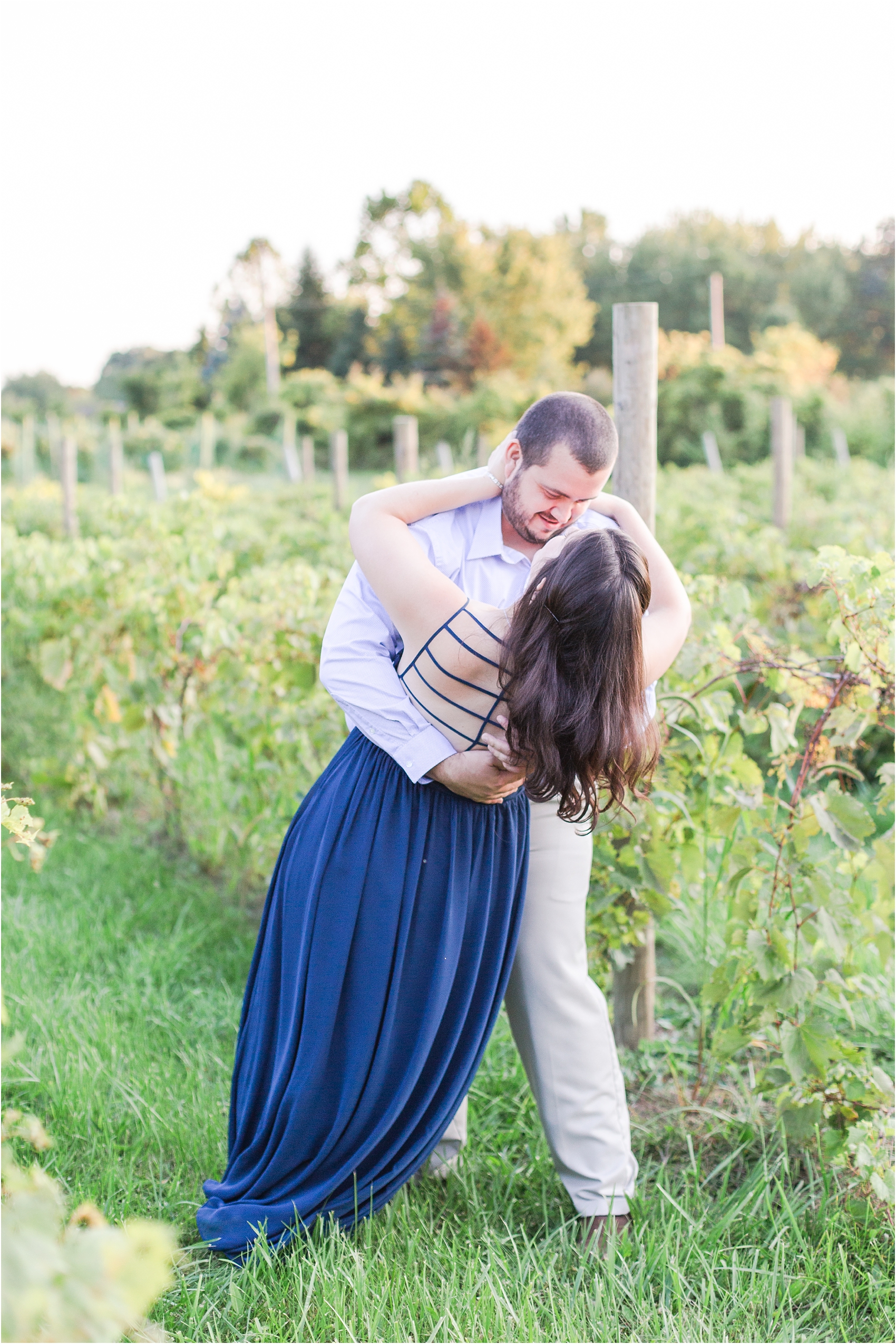 candid-romantic-summer-engagement-photos-at-hidden-lake-gardens-and-black-fire-winery-in-tipton-mi-by-courtney-carolyn-photography_0009.jpg