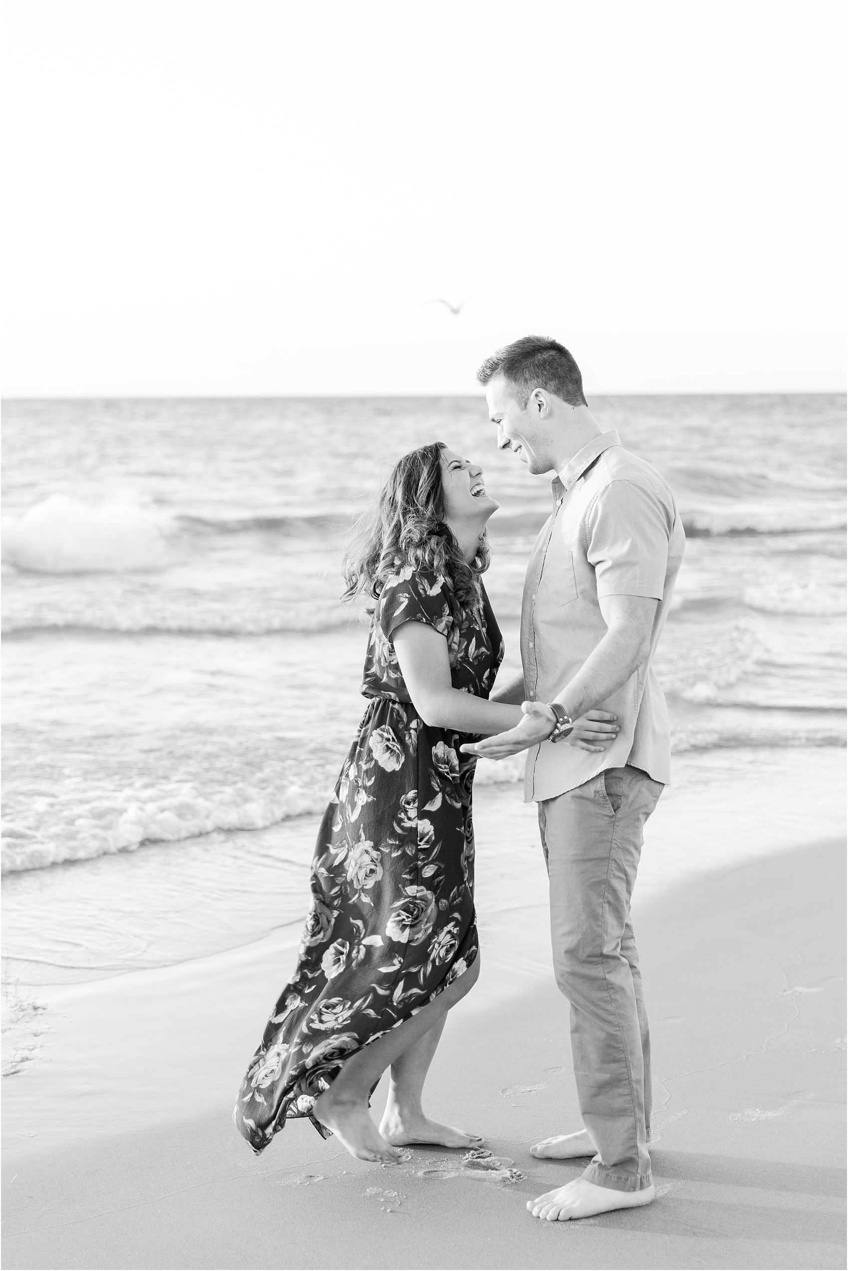 candid-end-of-summer-sunset-engagement-photos-at-silver-beach-in-st-joseph-mi-by-courtney-carolyn-photography_0024.jpg