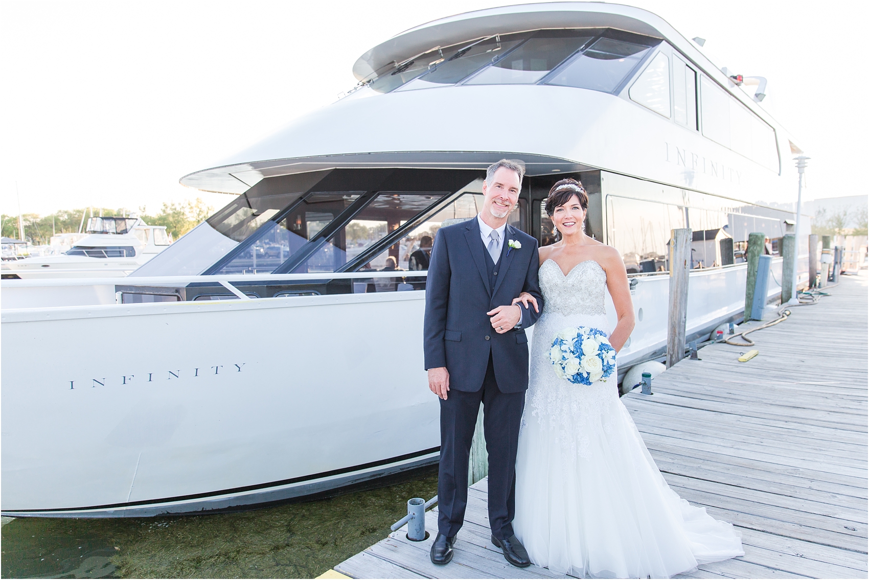 classic-natuical-inspired-wedding-photos-on-infinity-ovation-yacht-in-st-clair-shores-mi-by-courtney-carolyn-photography_0067.jpg