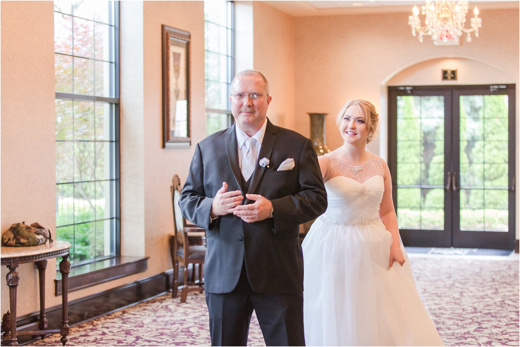 father-and-bride-share-emotional-first-look-on-wedding-day-photos-in-detroit-michigan-by-courtney-carolyn-photography_0002.jpg