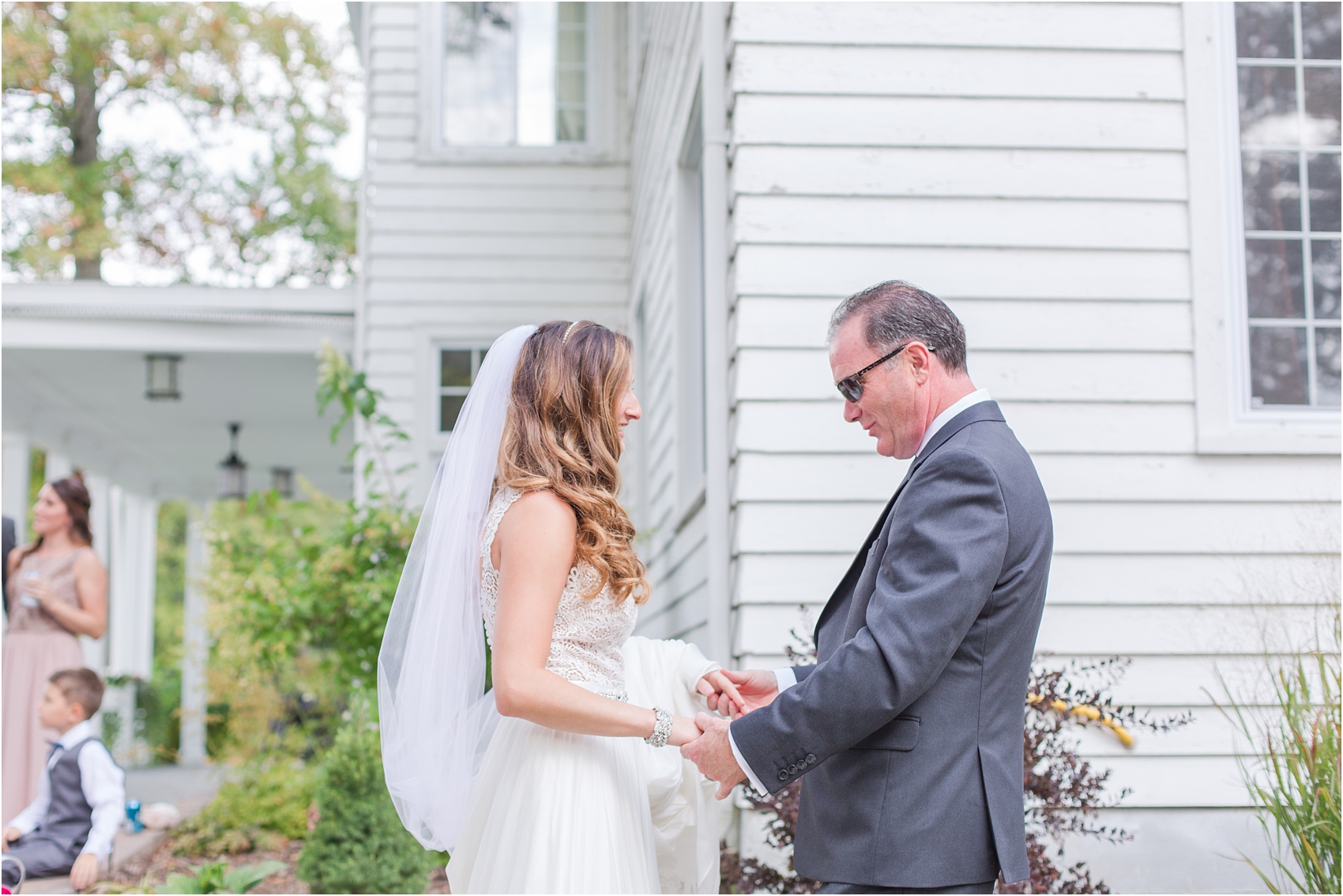 father-and-bride-share-emotional-first-look-on-wedding-day-photos-in-detroit-michigan-by-courtney-carolyn-photography_0064.jpg