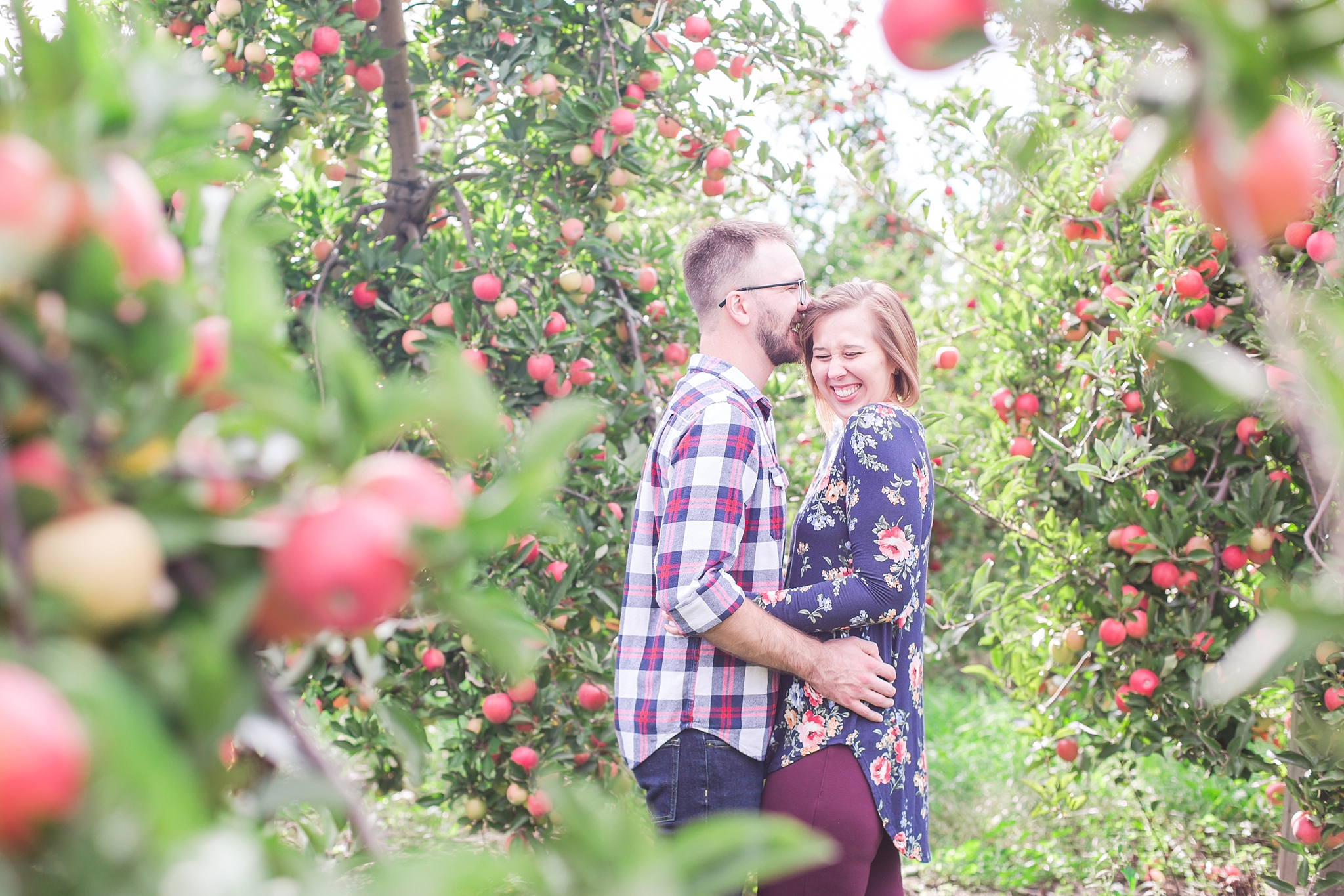 playful-fall-engagement-photos-at-hy's-cider-mill-ochard-in-bruce-township-michigan-by-courtney-carolyn-photography_0001.jpg