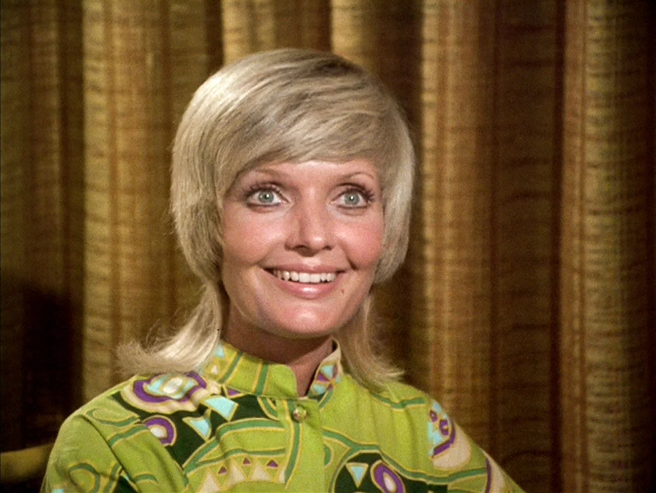 Florence Henderson as Carol Brady, the mom. Funky outfits, crazy hair.