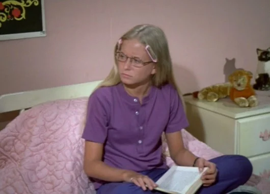 Eve Plumb, as middle daughter Jan. The middle child; jealous of Marcia.