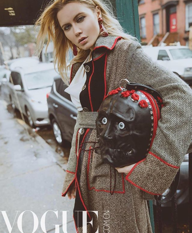 model in long gray coat with red piping by Marine Penvern, Vogue magazine