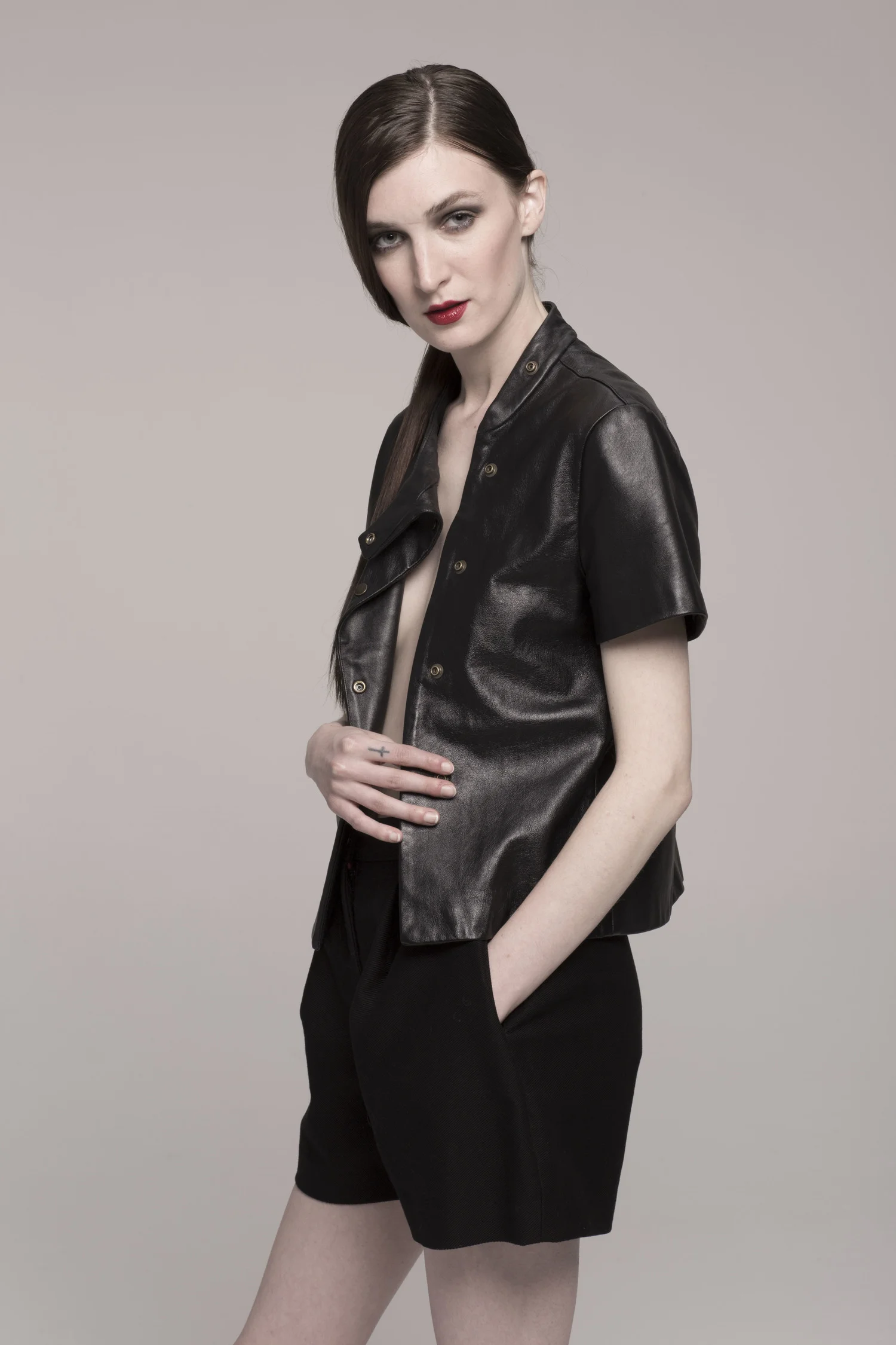 model in leather shirt, side view