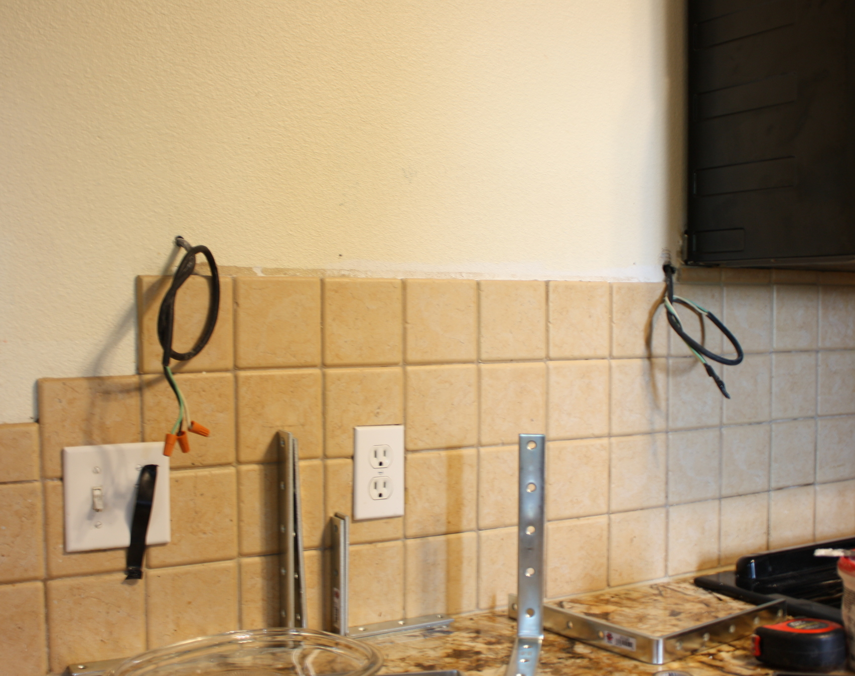 The wiring is from my under counter lighting that was attached to the cabinet! Notice the black piece of electrical tape on the switch so someone didn't accidentally flip that switch!!