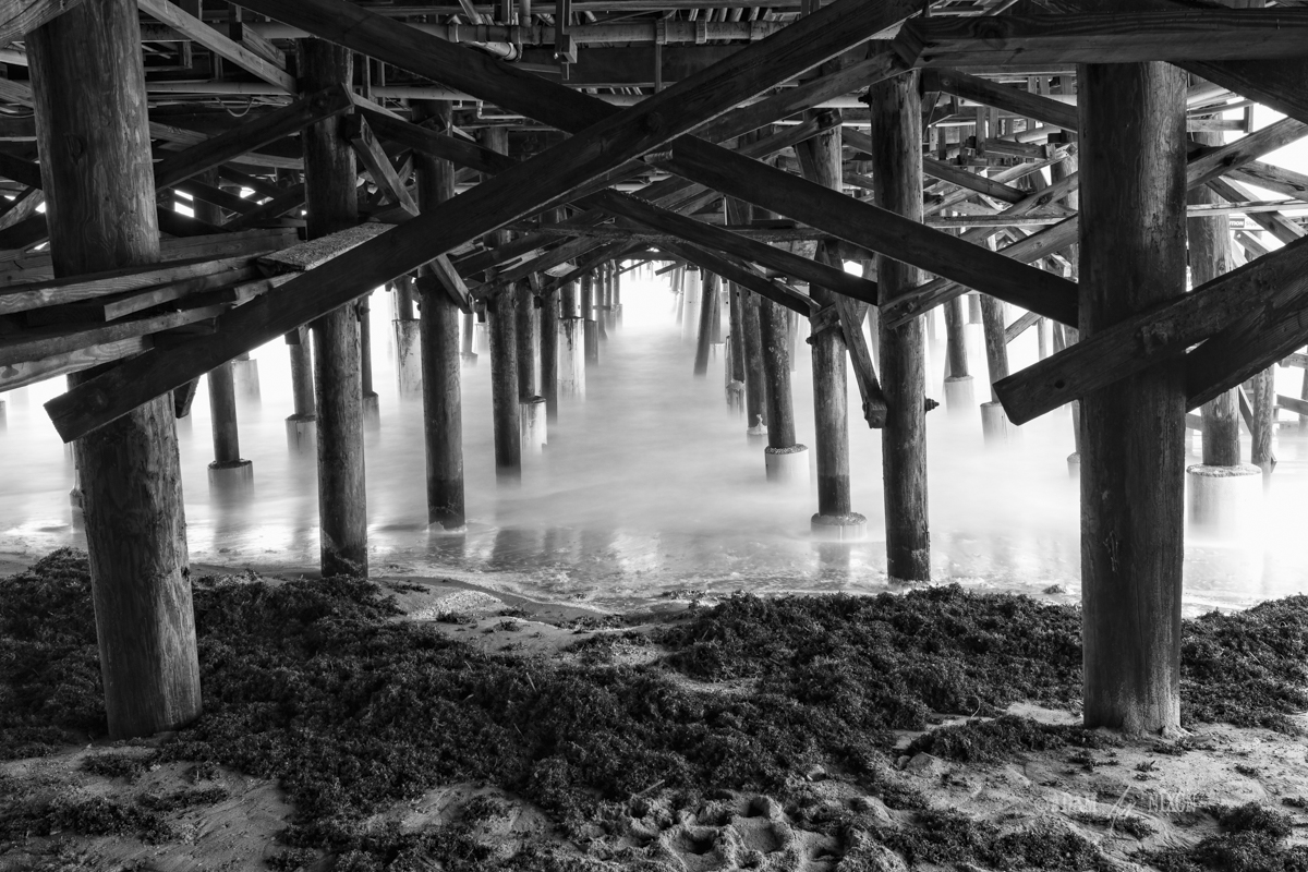 Underneath the Cocoa Beach Pier. Canon 5dIII w/16-35mm, 61sec @f/16, ISO 100. Processed in Lightroom 5, Photoshop CC 2014 and onOne Perfect B&W 9