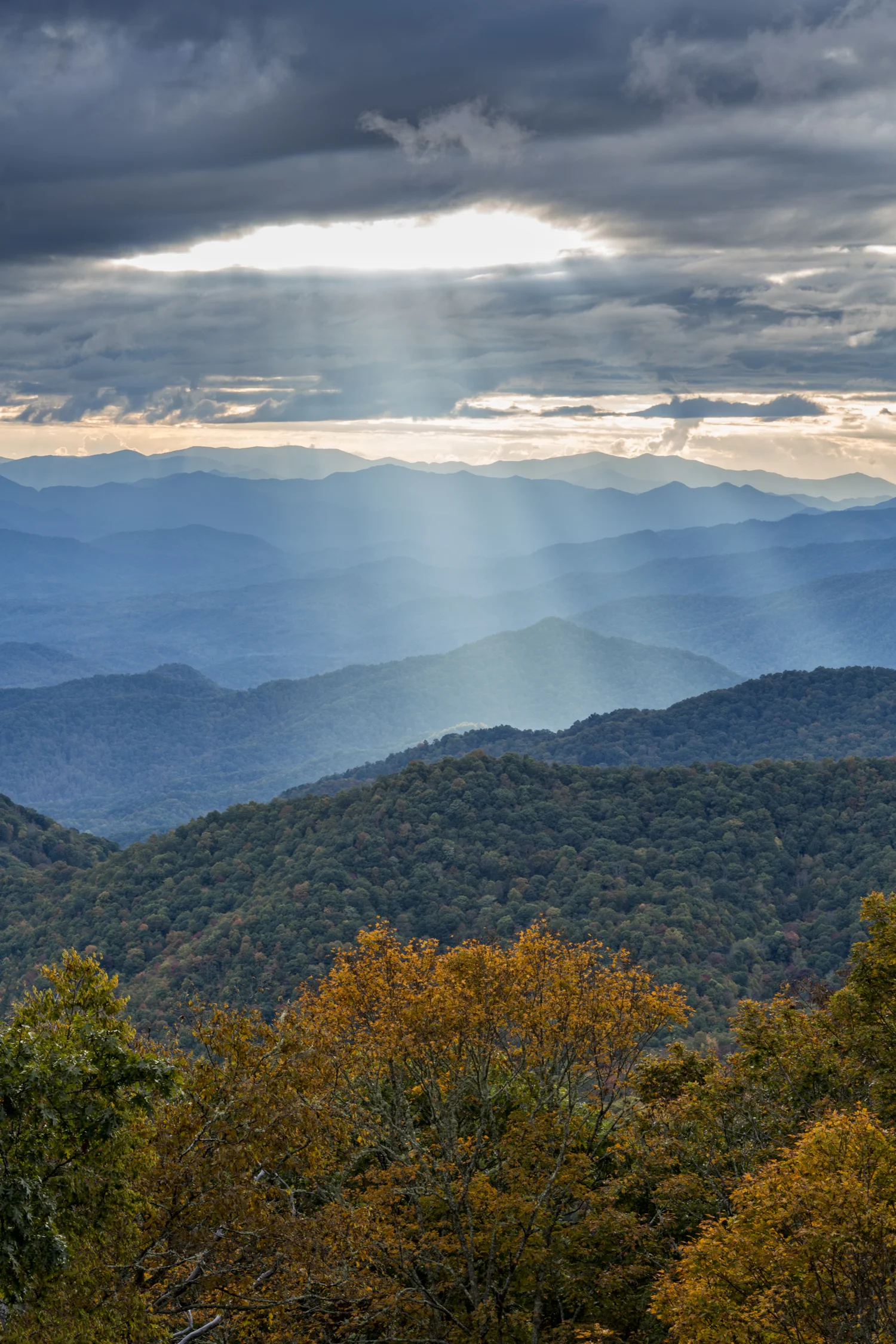 Sunbeams shine through a hole in the clouds