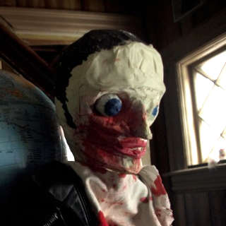 Greaser back at home after a rough night.