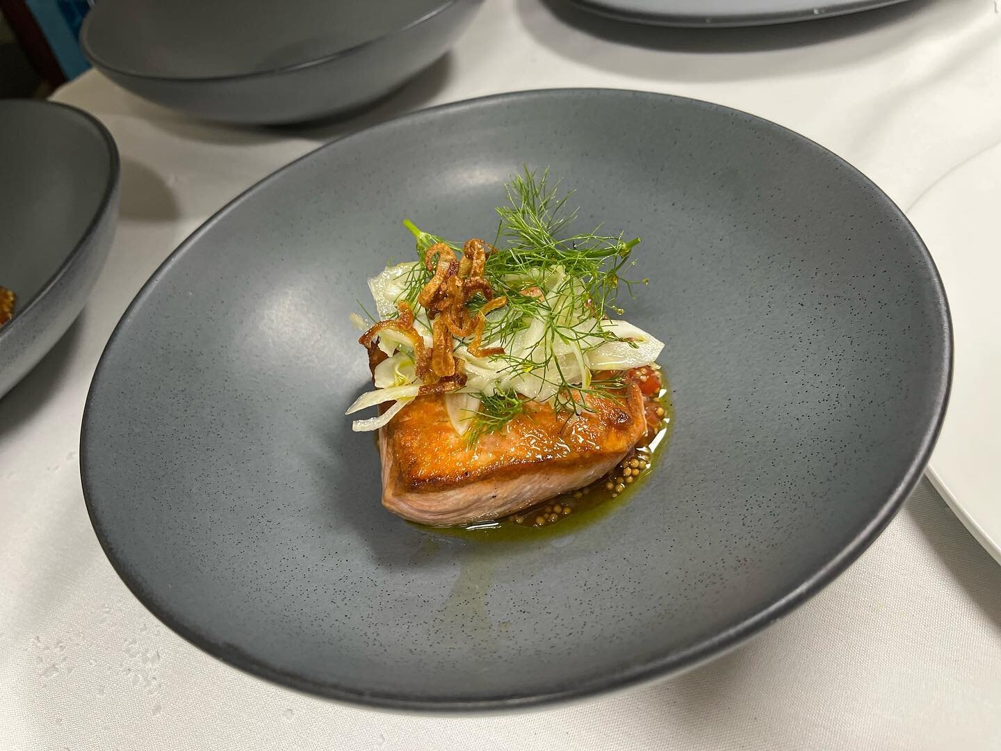 Local salmon with tomato mostarda, fennel, Laudemio Olive Oil, fried shallot, and charred cucumber water poured table side