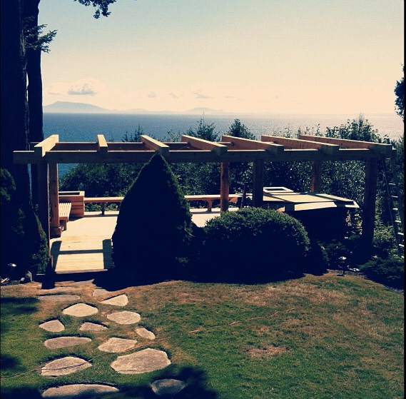 Large timber arbor over deck