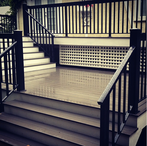 Composite deck boards with aluminum railing