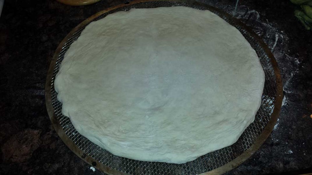 Dough is Spread Out and Placed on Pizza Screen