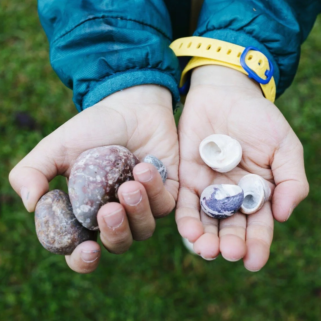 Solomon sharing the rocks and shells deemed worthy of bringing on his visit, which I consider quite an honor