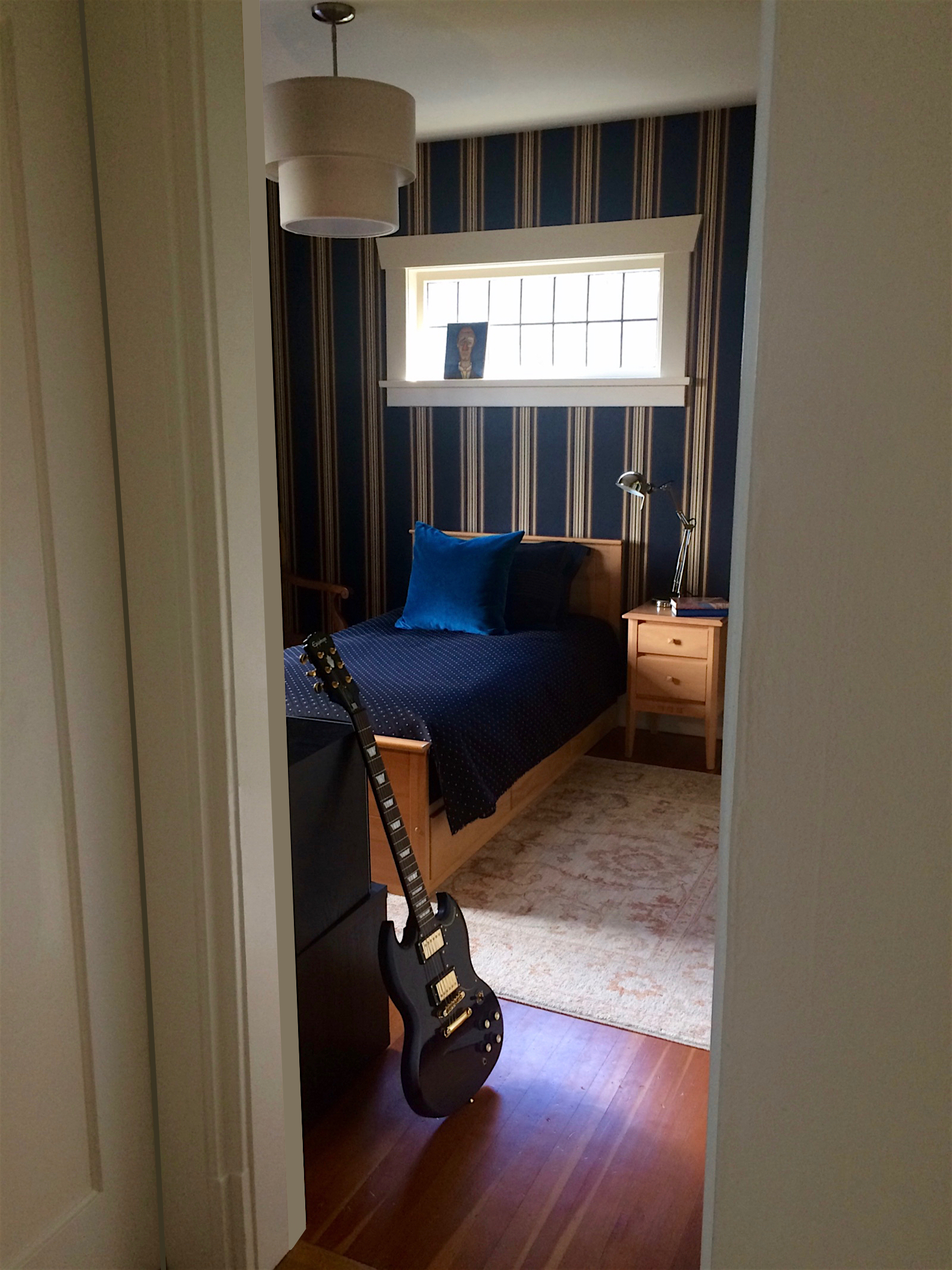 A sophisticated teenage boy requested his bedroom look like a gentlemen’s club with a few personalized touches.