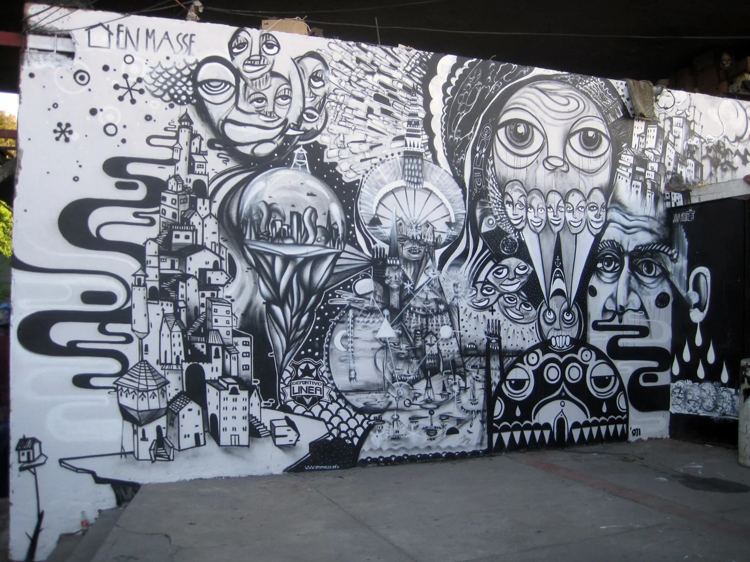 i met jason botkin and a few other awesome peeps from en masse when volunteering at the sd art fair which led to my participation in painting on this wall in mexico...we also painted on a moving car as it waited to cross the border...brilliant