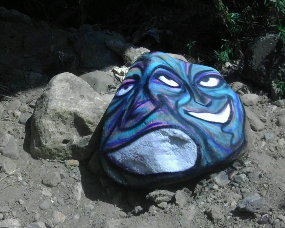 for whatever reason i've never felt comfortable painting on anything natural but once i did i definitely enjoyed it....the contours of this rock really lent themselves to the faces i've added