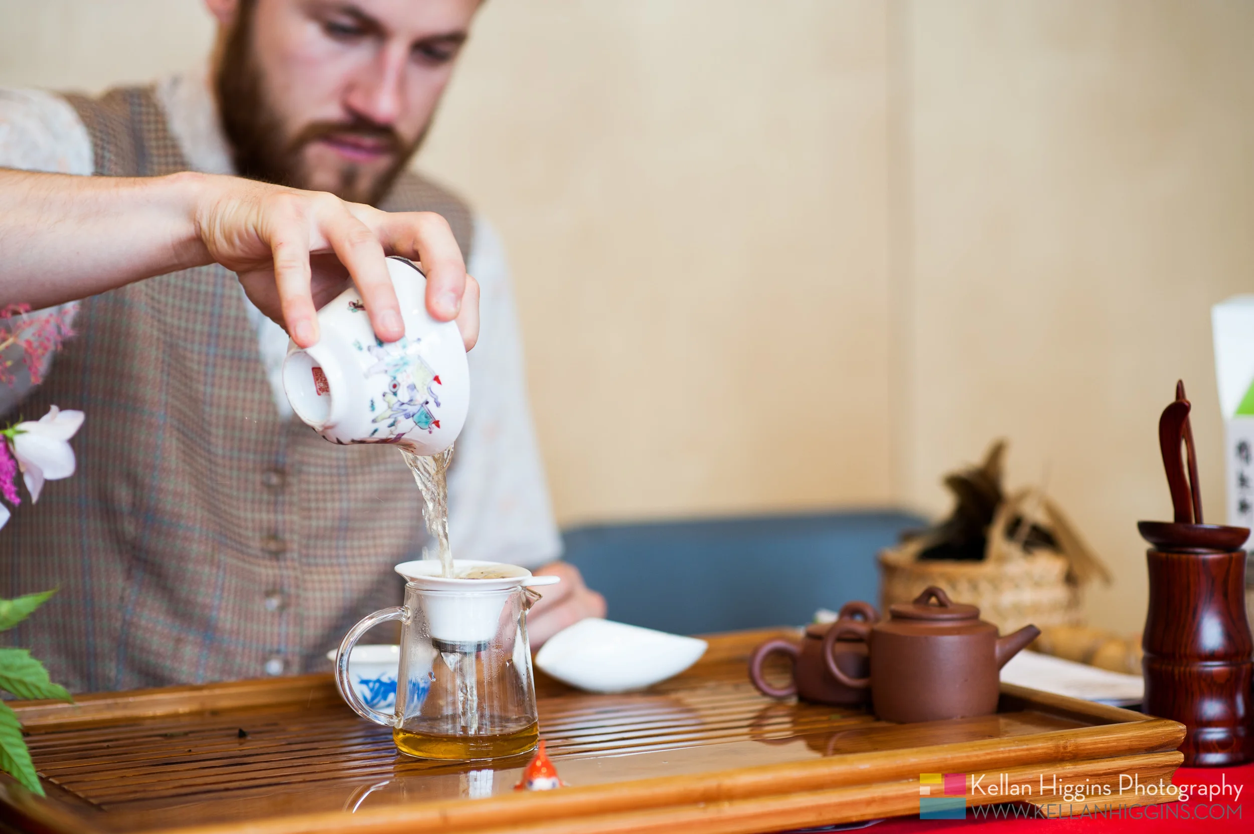 Adrian pouring tea in this special way.