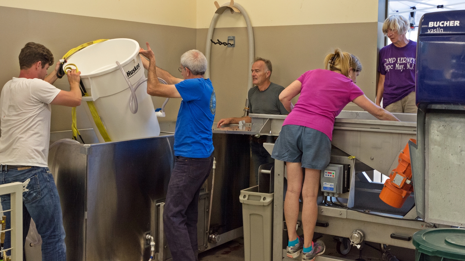 Putting fermentation buckets into tank  - David, Steve, me, Andy & Jane
