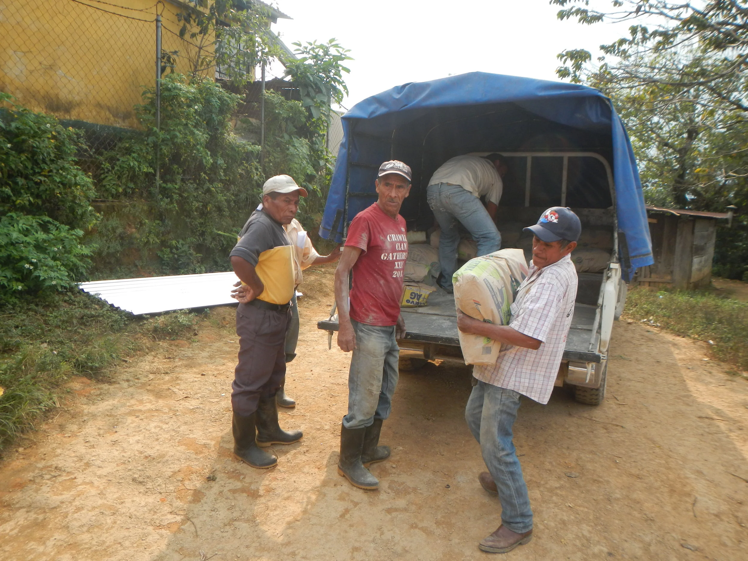 San Francisco villagers loading supplies to build the tank system