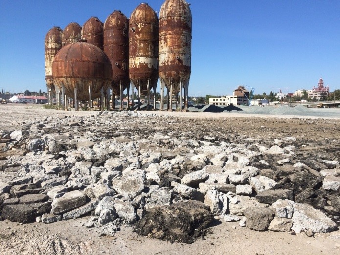 Crushed concrete from mill demolition. Also note that the Port saved some buildings and structures, like the “acid ball” and the “pulp digester” towers shown here, to contribute to the aesthetics of the planned redevelopment.