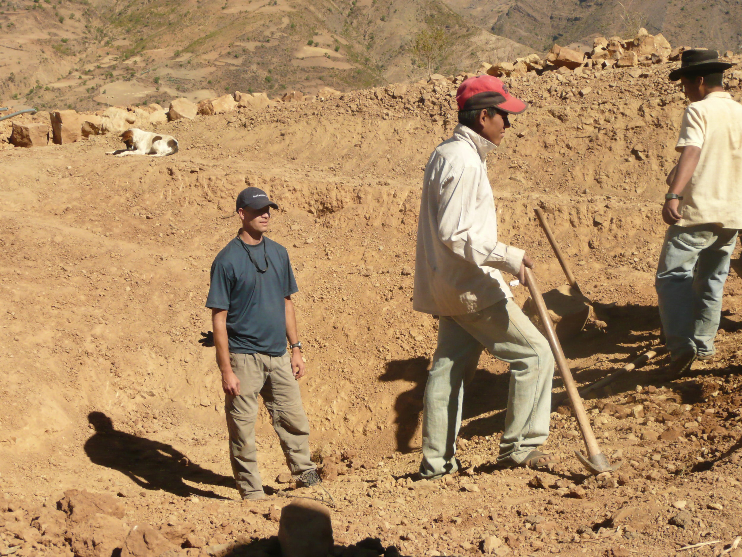 Dave Cook and local project team doing water supply work in Bolivia