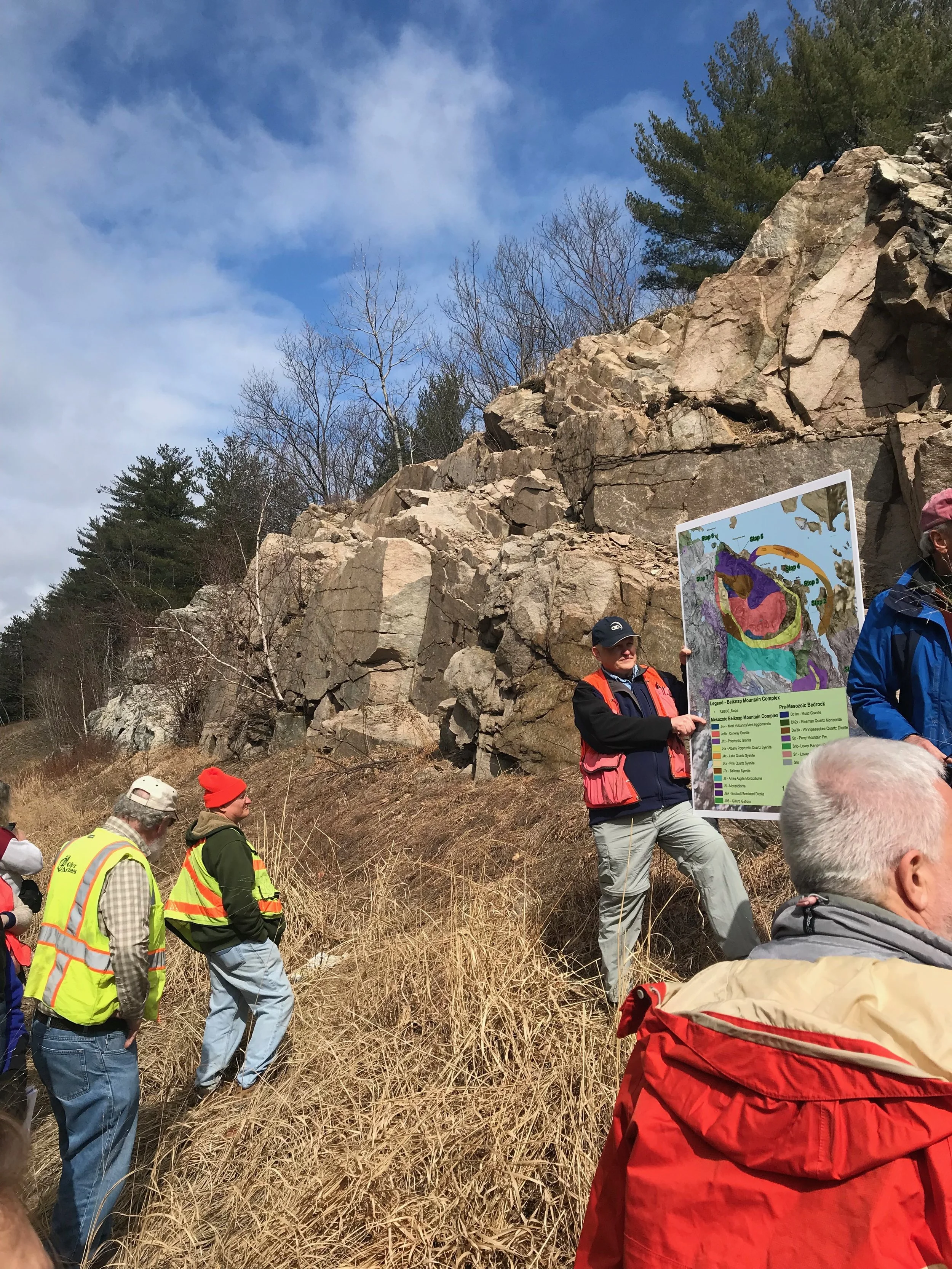 Geologists love a good roadcut! A quarts syenite ring dike intrudes pre-Mesozoic tonalite.