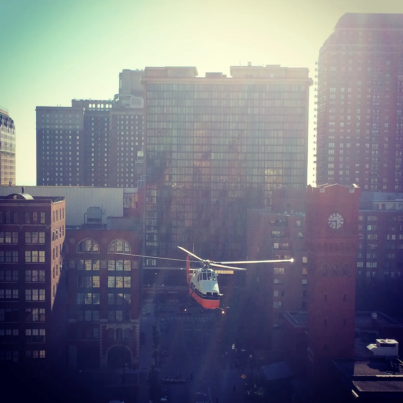I also woke up one morning thinking it sounded like a helicopter was right outside my window...well it was. They were installing new air conditioning units in the building across the street and this was right outside of April's apartment.