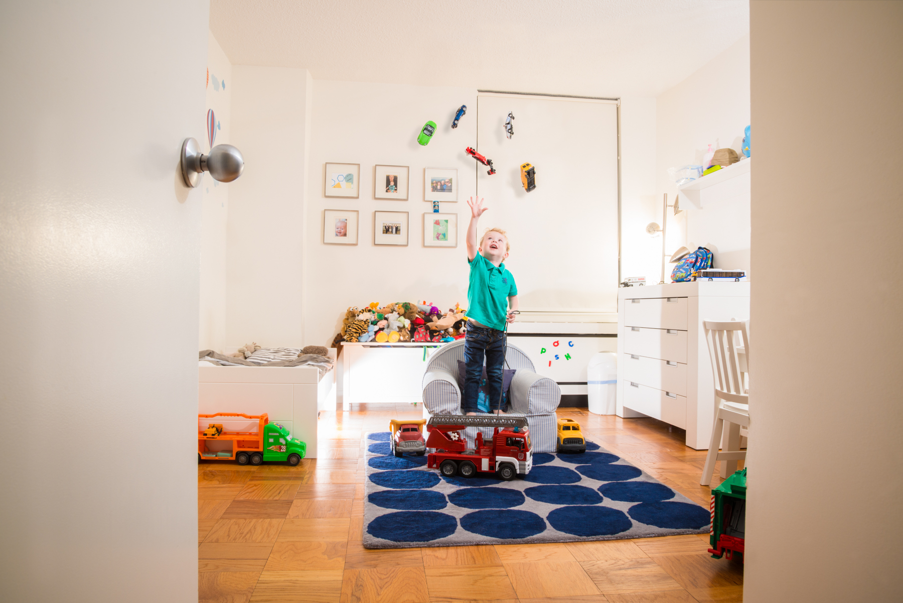 I love this fantasy shoot I did for an amazing family in New York City. Lucas is, a 3 year old obsessed with trucks. To capture this stage in his life I creating a sneak peek into a magical fantasy land in his room where gravity was suspended and the wonder of life was explored.