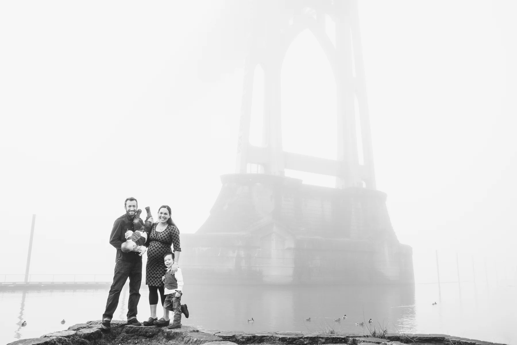 In late January Portland had a crazy week of really heavy fog. It was so beautiful seeing the city and the bridges disappear into the fog and turned into a great backdrop for this family portrait session in Cathedral Park.