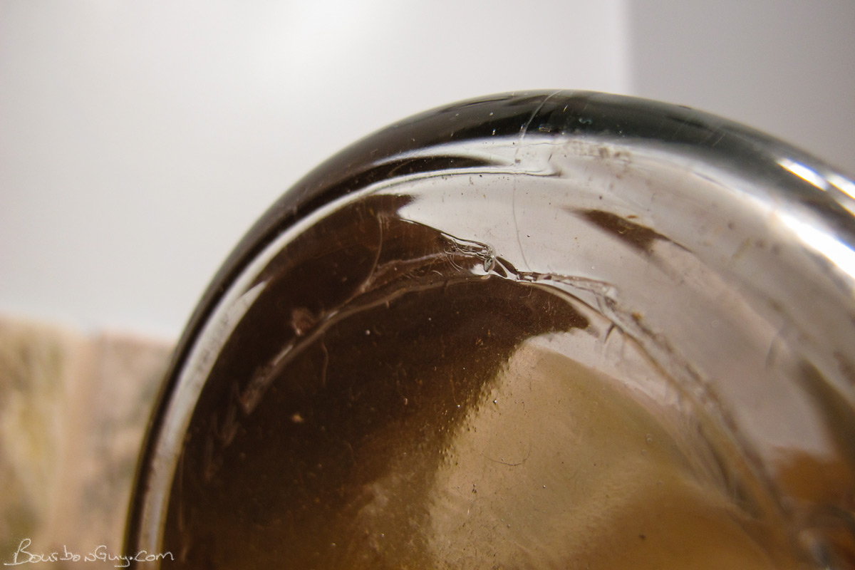 Suction scar from bottle making machine.