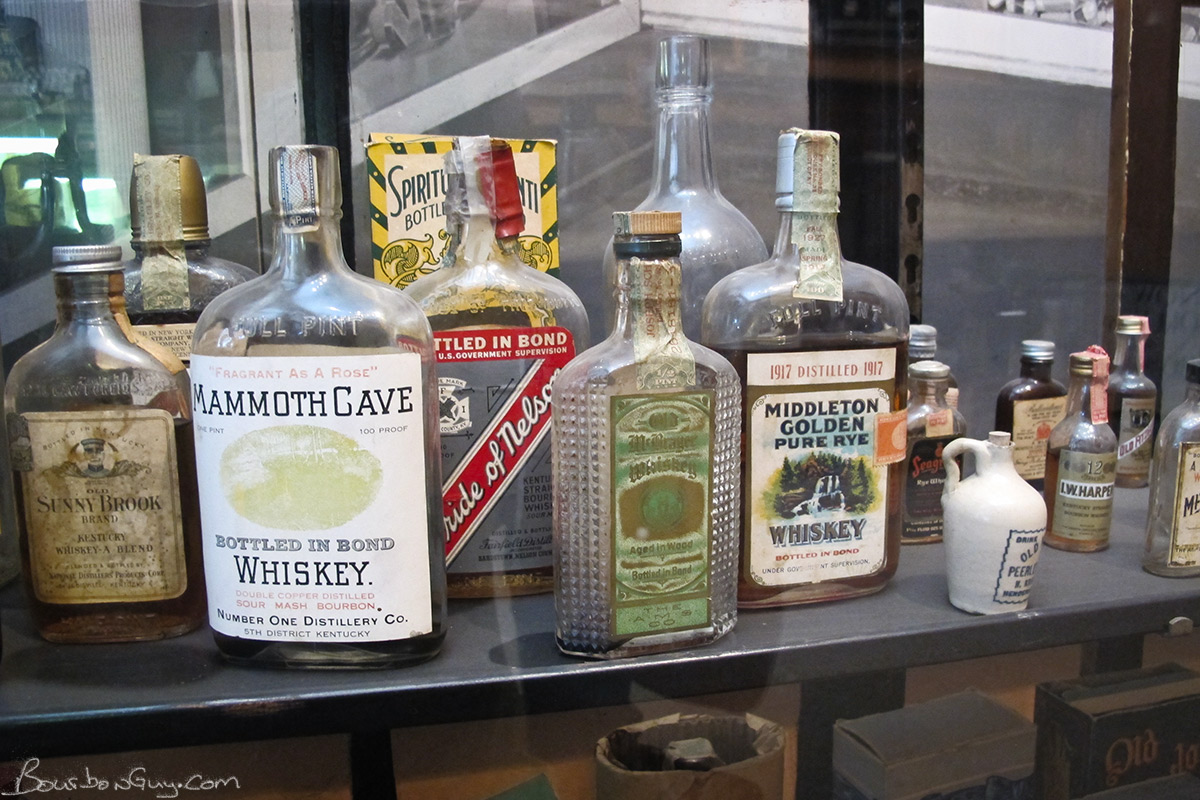  Old Whiskey bottles in a display case 