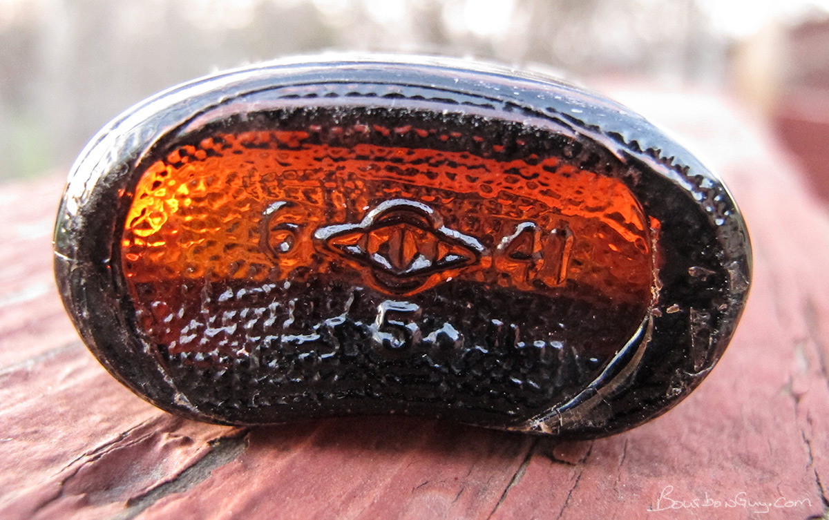 the bottom of a Four Roses miniature bottle from 1941 as seen by the 41 date code.