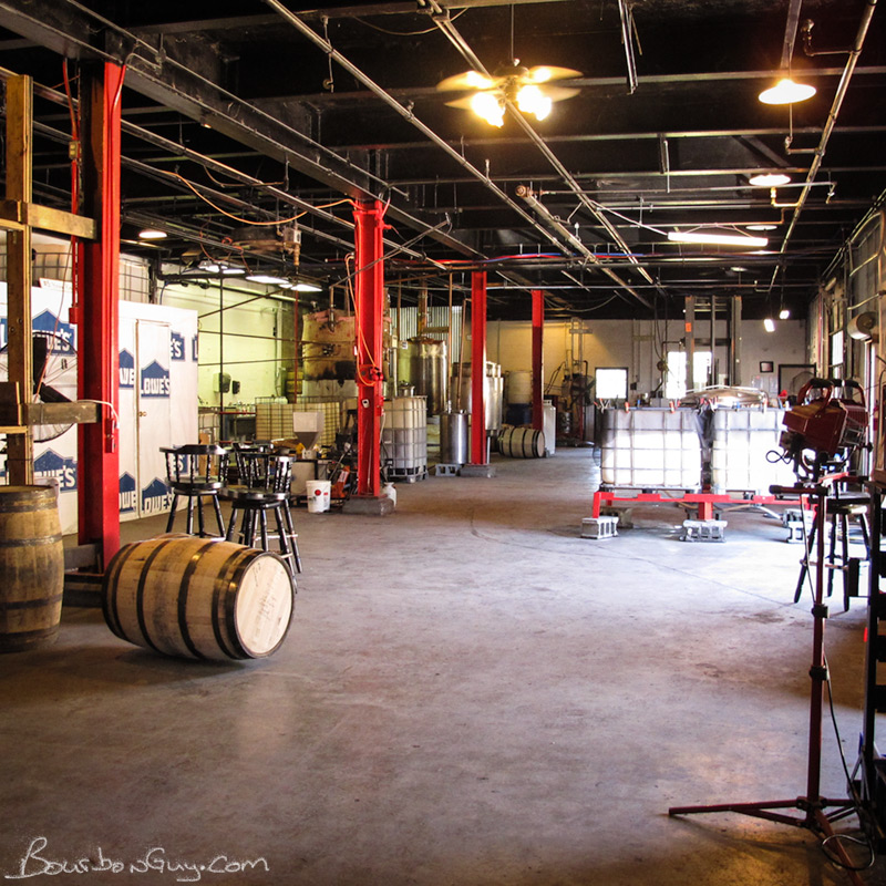 A look at the entire operation. Barrels, yeast, fermenters, cooker and stills.