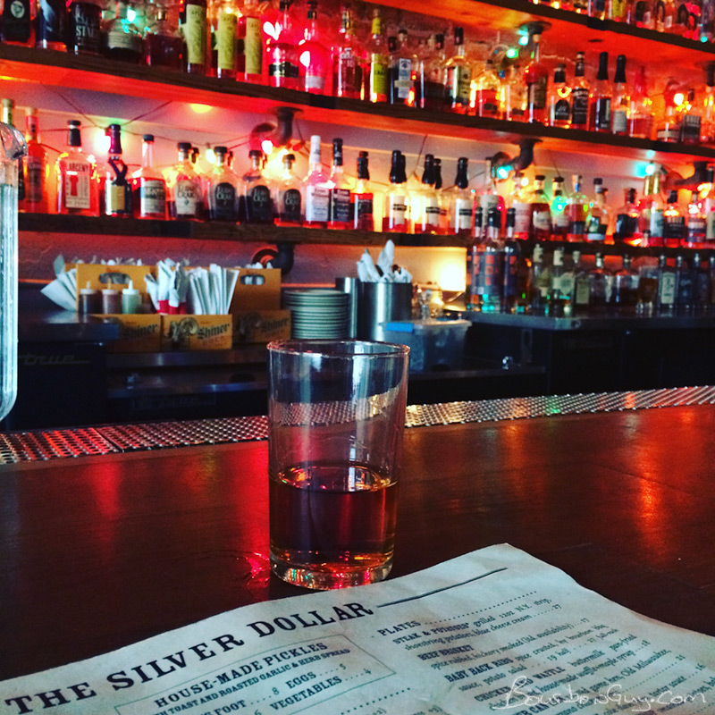 A shot of my glass on the bar of the Silver Dollar.