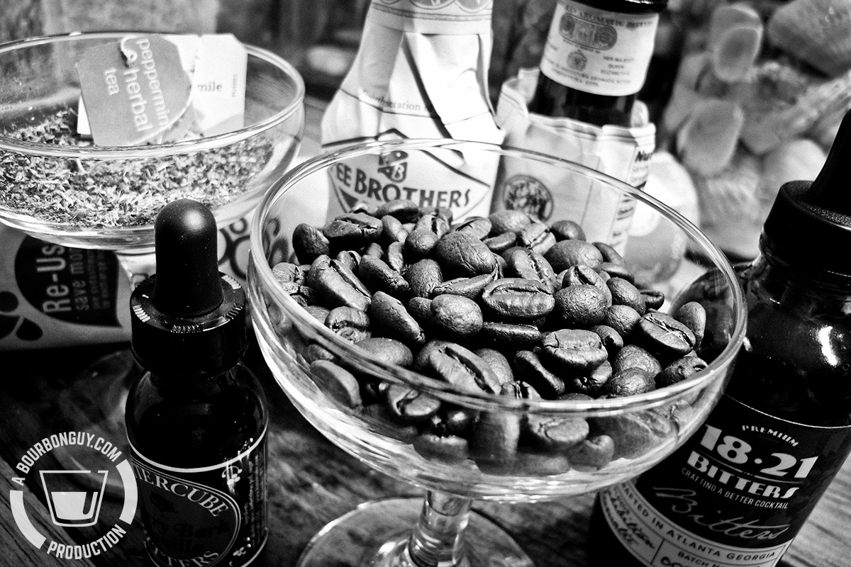 coffee beans in a coupe glass, herbal teas and cocktail bitters
