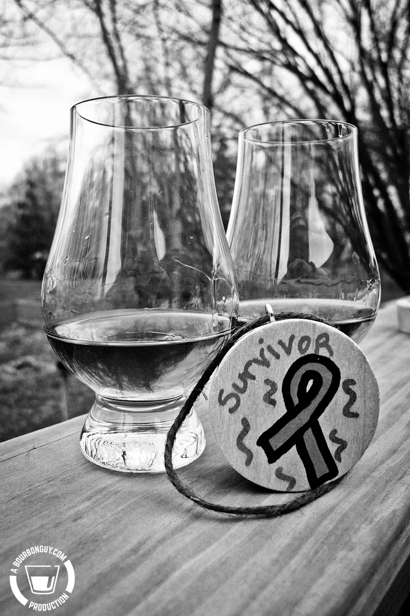 Two glasses and a barrel bung.