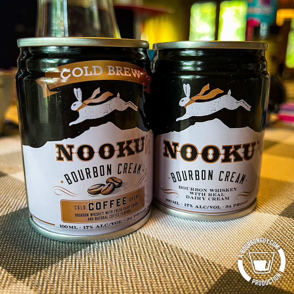 IMAGE: Two 100mL cans of Nooku Bourbon Cream. One original and one Cold Press Coffee Flavor
