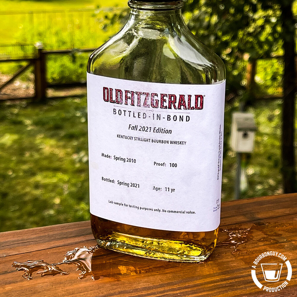 IMAGE: A 200 mL sample bottle of Old Fitzgerald Bottled in Bond, Fall 2021 sitting in the rain.