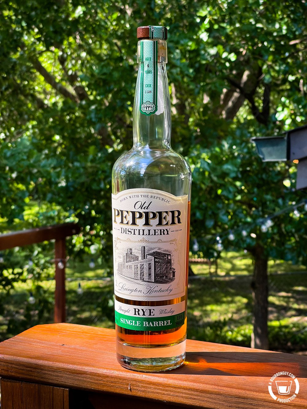 IMAGE: A tall bottle of Old Pepper Single Barrel Rye sitting in the sunlight.