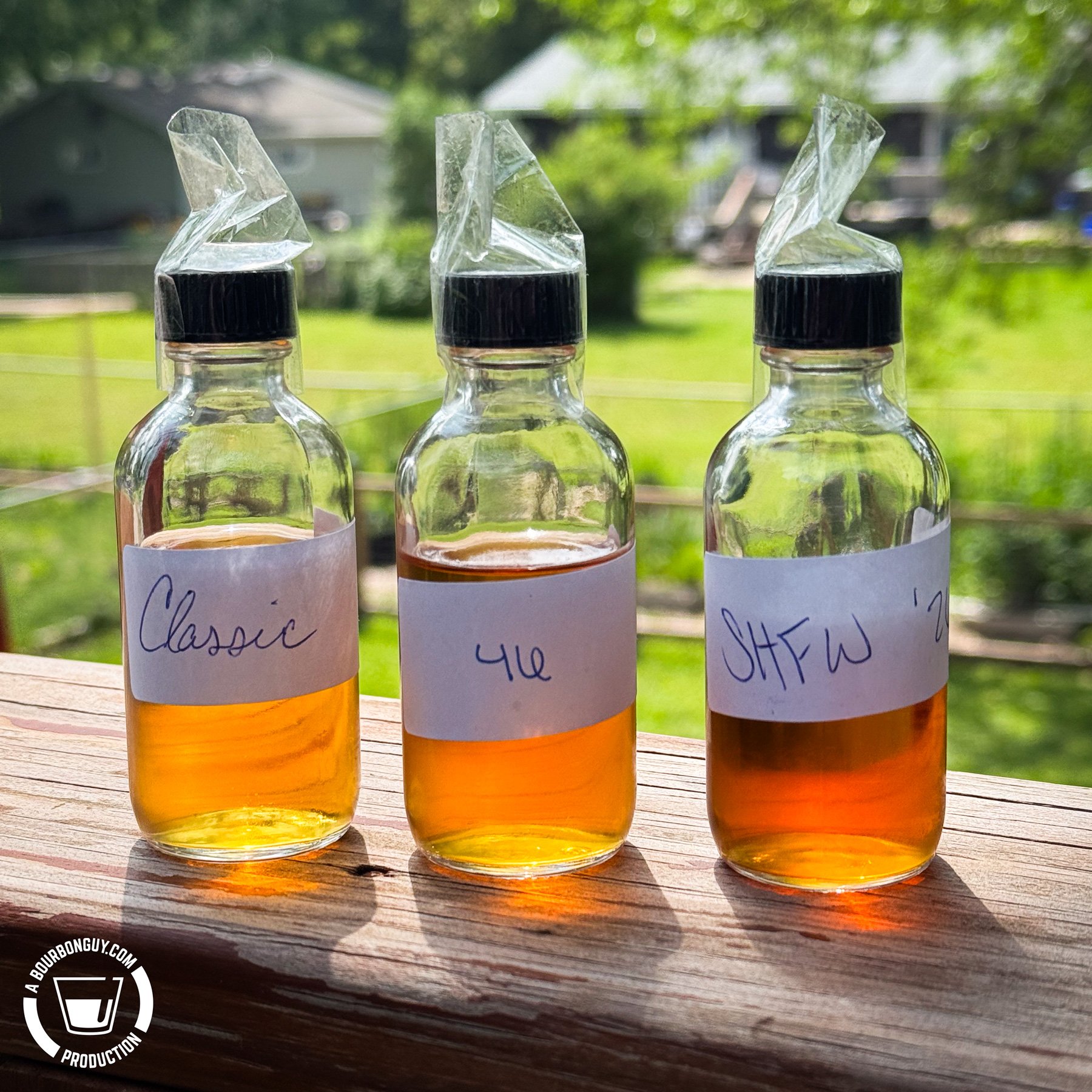 IMAGE: Three still-sealed half filled sample bottles with hand written and abbreviated labels.