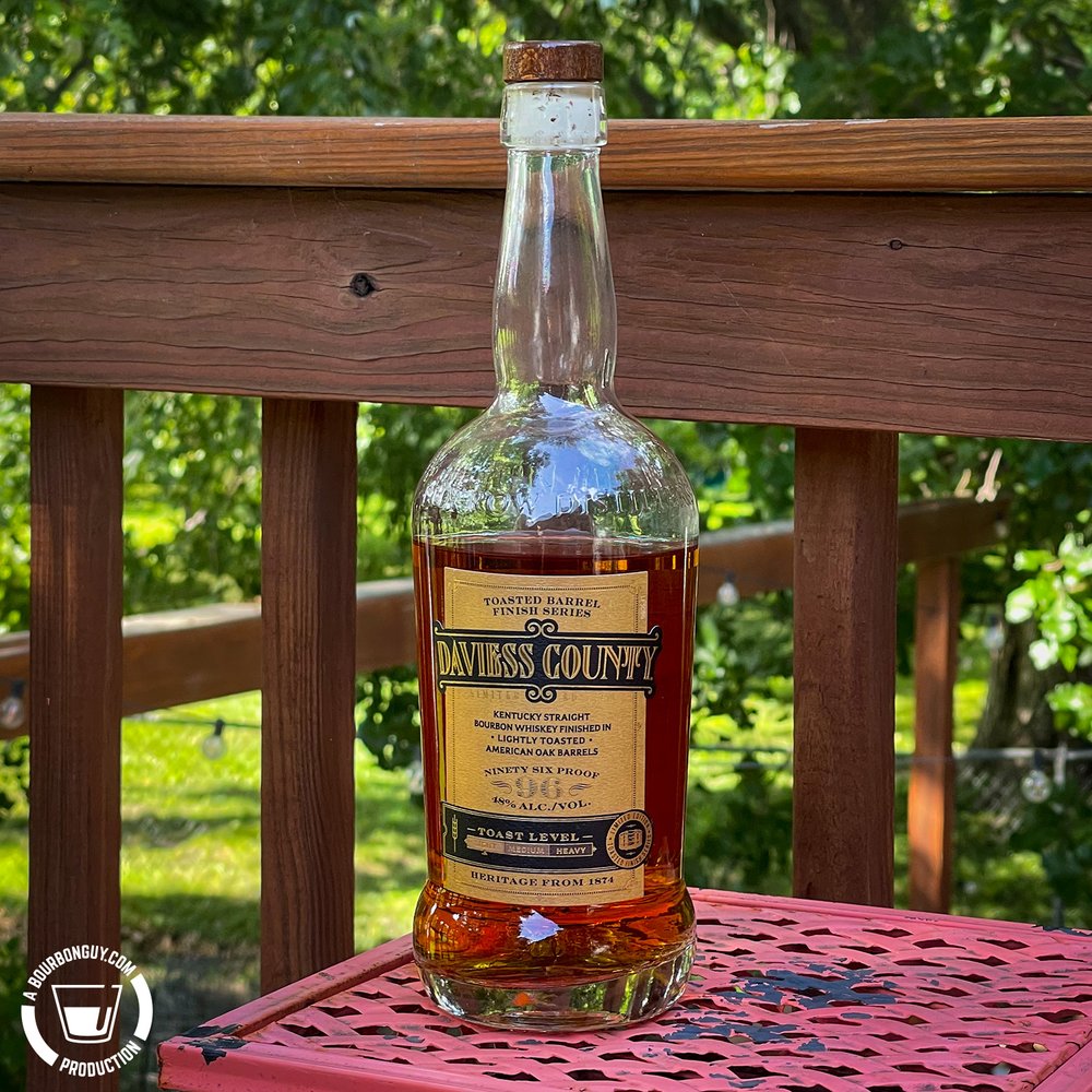 IMAGE: a partially full bottle of Daviess County Lightly Toasted Barrel Finished Bourbon