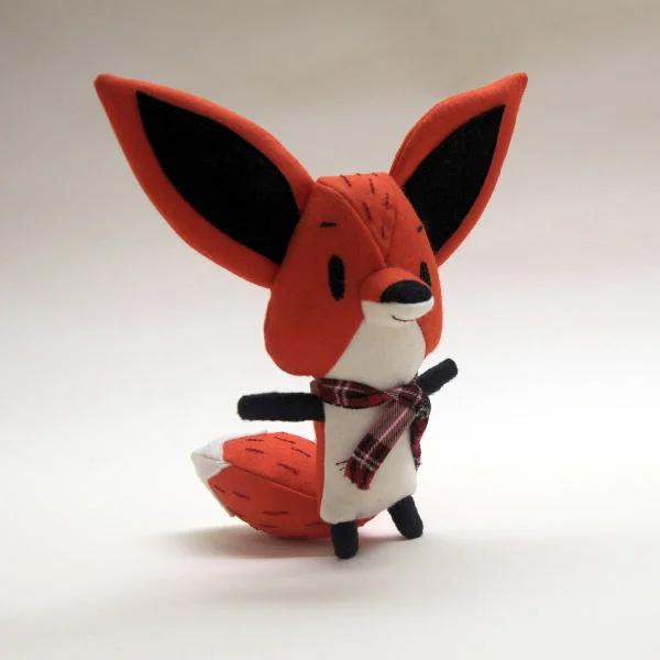 Here is a little fox that I made, he has embroidered features.