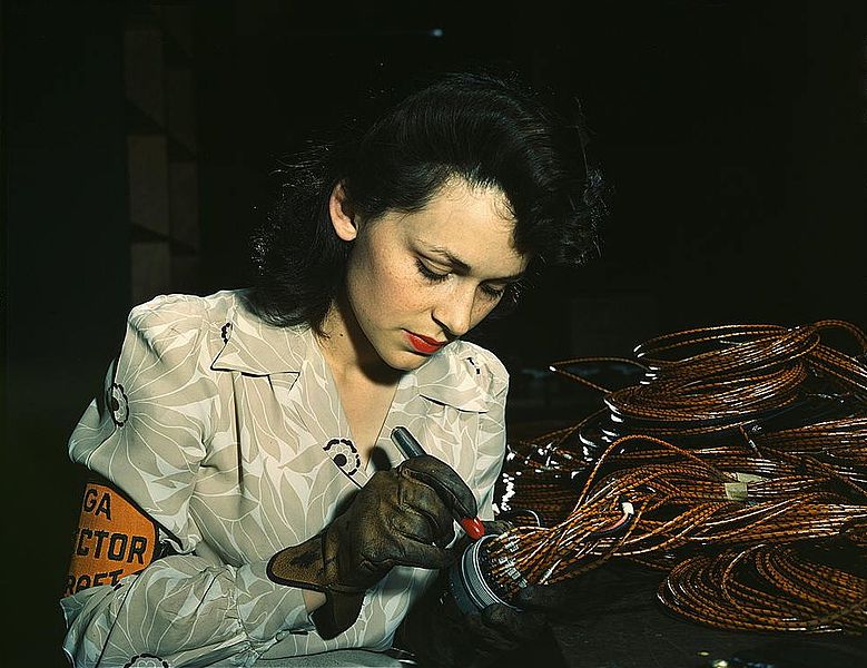 779px-Woman_aircraft_worker,_Vega_Aircraft_Corporation,_Burbank,_Calif._Shown_checking_electrical_assemblies_(LOC)
