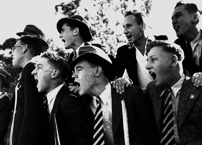 StateLibQld_2_201203_Cheering_schoolboys,_possibly_at_a_sporting_event,_1940-1950.jpg