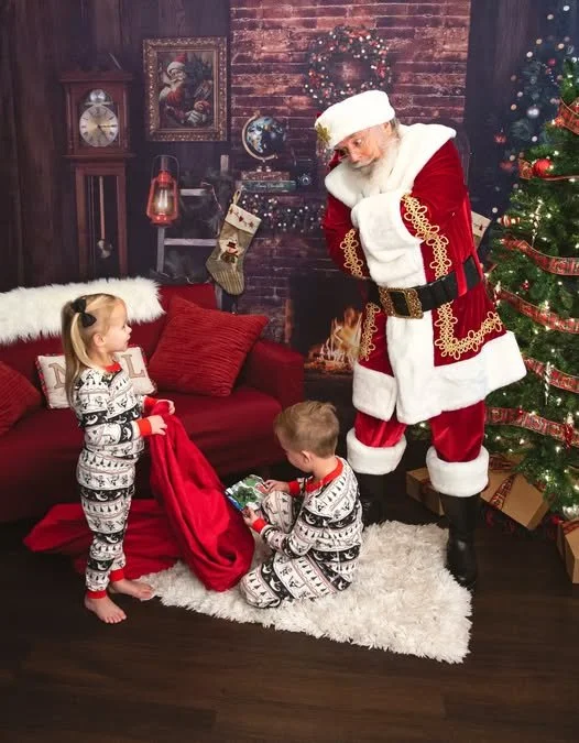 A magical Christmas moment captured during a Santa session in Gilbert, Arizona. Perfect example of a unique, storybook-style portrait by a Gilbert Arizona child and family photographer.