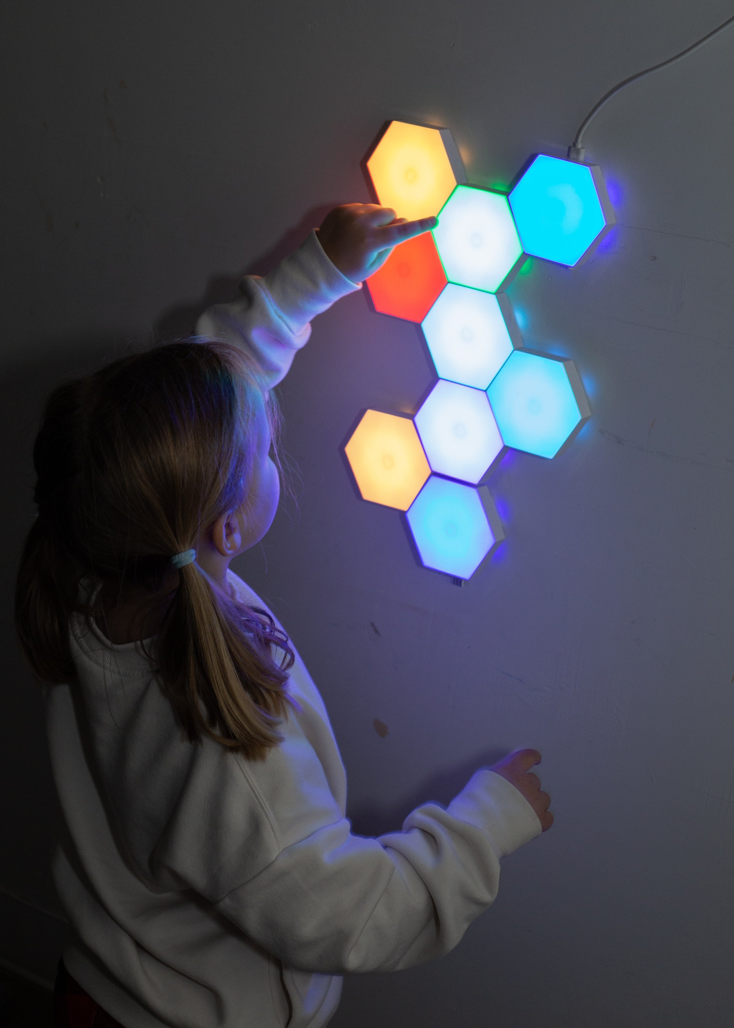 A child plays in a quiet sensory room nside this mesa arizona playspace and community space for parents
